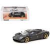 Pagani Utopia Black Carbon Fiber with Gold Wheels
